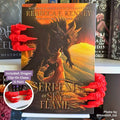 Red 3D printed Dragon Claws Curio Clip-Ons framing the fantasy book Serpents of Sky and Flame by Rebecca F. Kenney, clipped onto a Curio Candy Floating Book Display Hanger.
